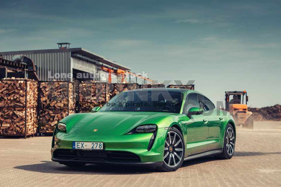 Porsche Taycan Turbo S Electric EV green clear car auto mobile wood factory backyard parked parking lot clean plugin supercar power shinny day summer hot rental