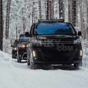 A Group of vans goes expedition at the snow forest