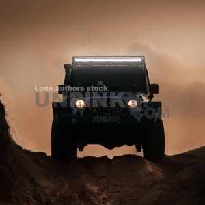 Jeep Wrangler Rubicon at the middle of desert with a LED bar