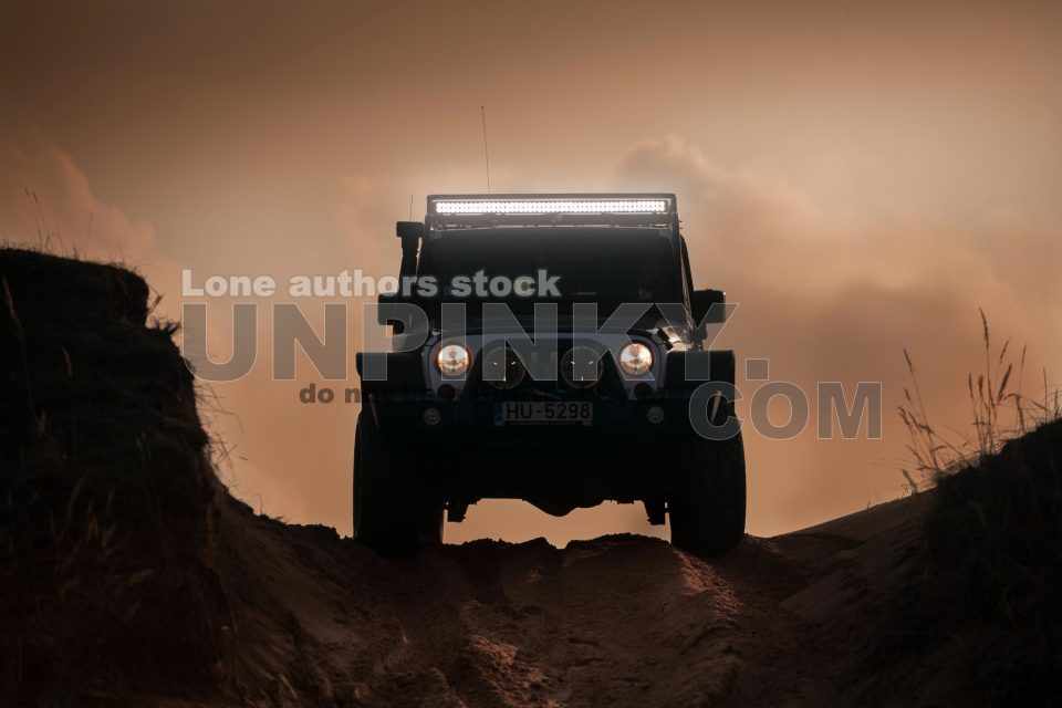 Jeep Wrangler Rubicon at the middle of desert with a LED bar