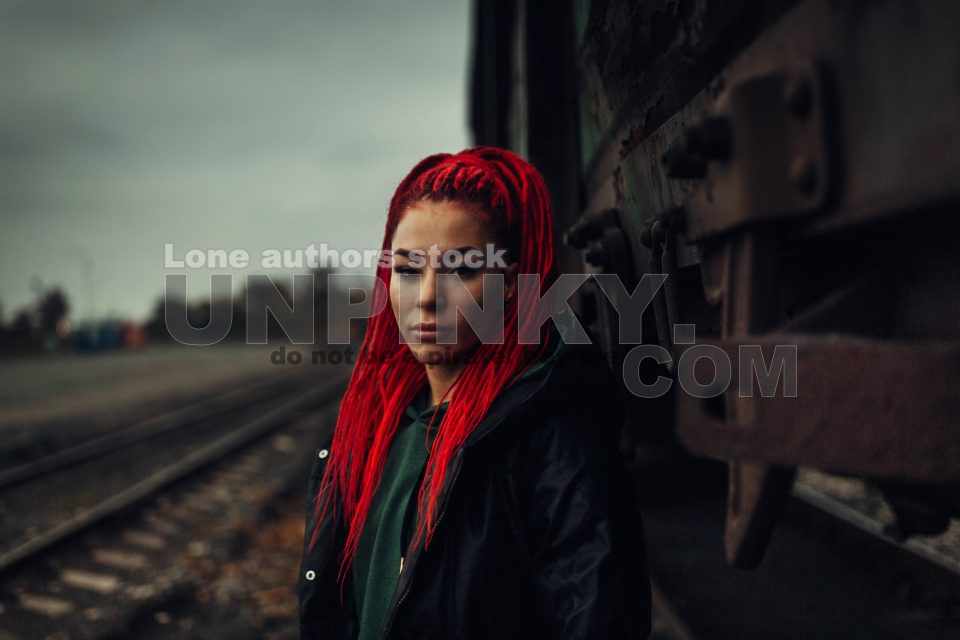 Portrait off beautiful woman with red hairs