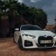 BMW 430I convertible between palms | Editorial