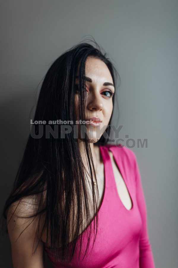 Portrait of an attractive woman at the darkroom.