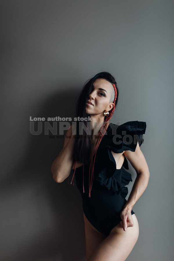 Portrait of an attractive woman at the darkroom.