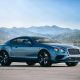 Bentley Continental GT supercar near lake and mountain background | Editorial