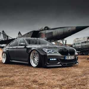 BMW 7 series G11 with carbon widebody kit at the airport museum