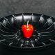 Car rims with red pepper close up