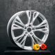 Car rims at the dark background with yellow pepper