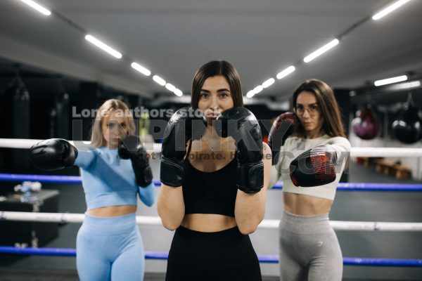 Girls at ring during kickboxing training