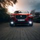Jaguar F-Pace in the motion at the city street. Luxury car go fast | Editorial