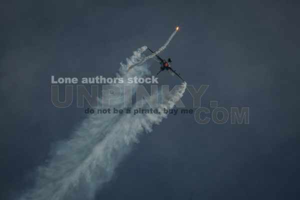 Modern jet fighters shooting fire flares rockets with sparks. Airplane deploying . fire protection IRCM