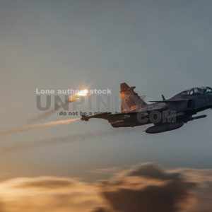 Modern jet fighters shooting fire flares rockets with sparks. Airplane deploying . fire protection IRCM