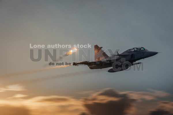 Modern jet fighters shooting fire flares rockets with sparks. Airplane deploying . fire protection IRCM