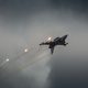Modern jet fighters shooting fire flares rockets with sparks. Airplane deploying . fire protection IRCM