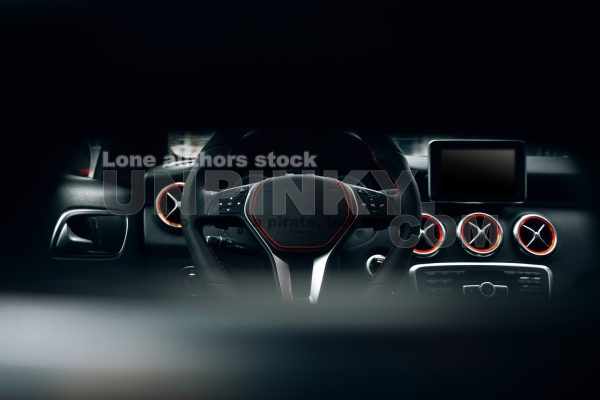 Modern and sport car interior with comfortable dark leather seats, multimedia and dashboard