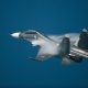 Modern tactical jet fighter at the sky. Plane generated steam during supersonic speed