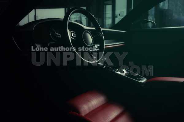 Modern supercar interior at the dark