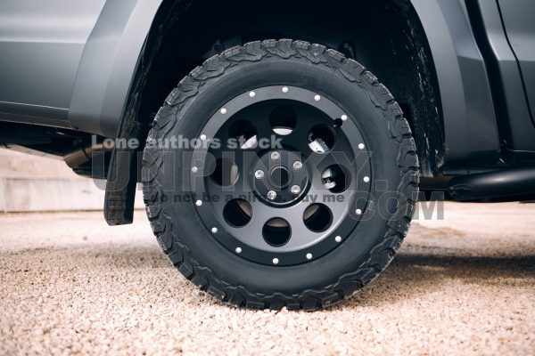 Suv car stopped at dirt road. Truck car wheel disassembly protection locked ring.