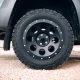 Pick up car stopped at dirt road at the off-road trip. Truck car wheel disassembly protection locked ring