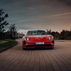 Porsche Taycan Turbo S going fast on the highway | Editorial