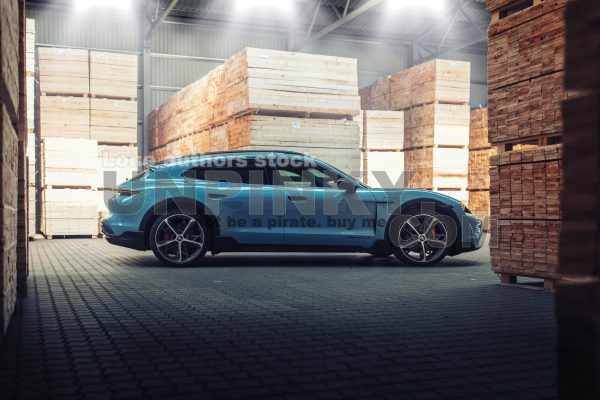 Porsche Taycan Turbo S Cross Turismo at the wood factory | Editorial