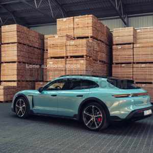 Porsche Taycan Turbo S Cross Turismo at the wood factory