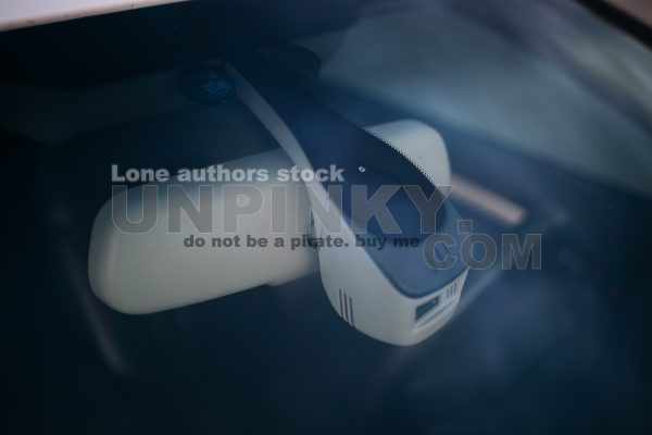 Rain and light sensor on the windshield of the car