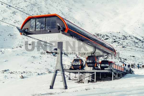 Modern funicular in the mountain at the ski resort with cabins