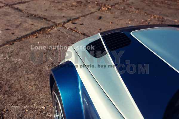 Modern sport car hood with air intake inlet