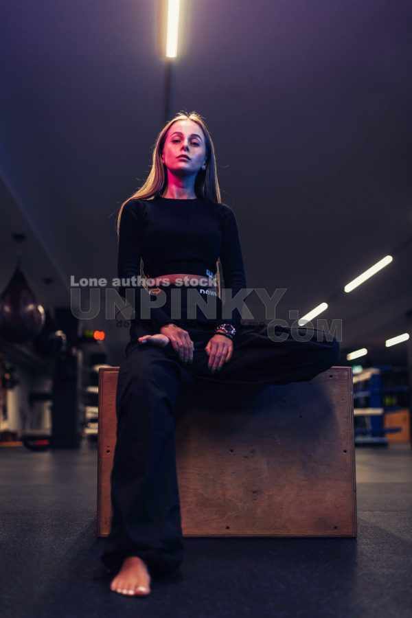 Portrait of sporty young girl with neon glow