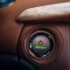 Start and stop engine button in electric sports car. Car ignition system at the panel