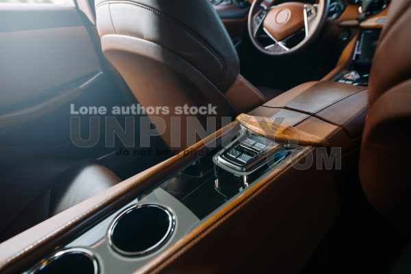 Start and stop engine button in sports car. Car ignition system at the panel