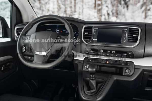 Modern SUV car interior with the leather panel, multimedia, and dashboard