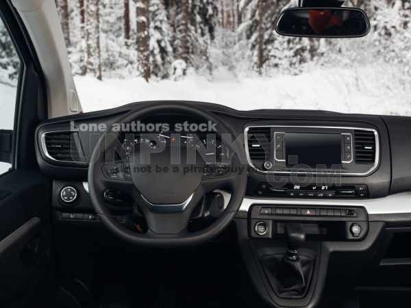 Modern SUV car interior with the leather panel, multimedia, and dashboard