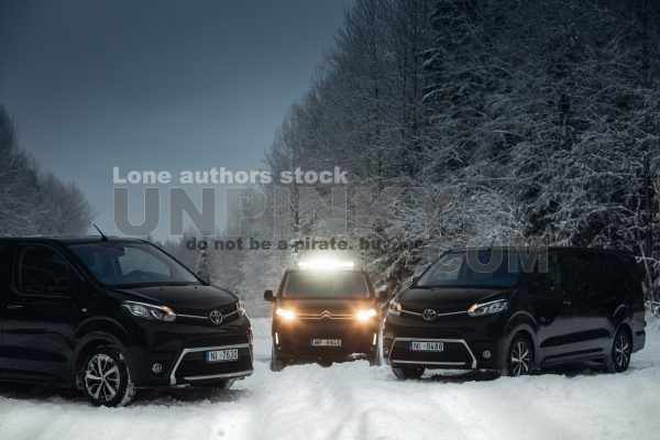 Group of vans go expedition at the snow forest