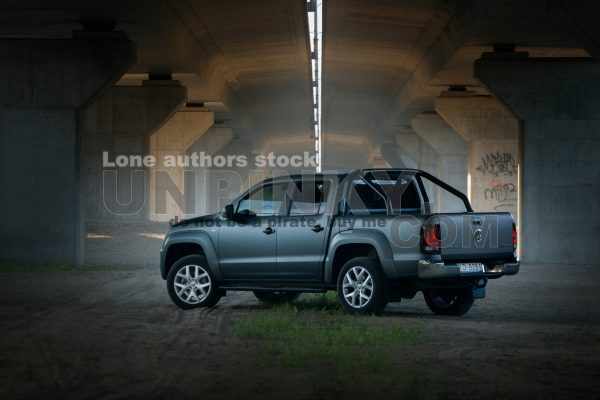 Volkswagen Amarok under bridge at the morning