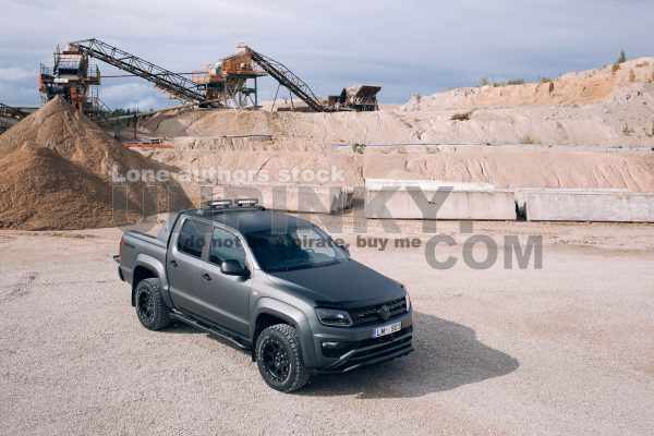 Volkswagen Amarok Aventura 4MOTION 3.0 V6 TDI front side at gravel extraction