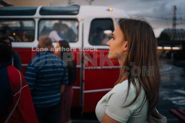 Woman at the bus station. Girl is waiting after her friend at terminal