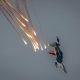Modern jet fighters shoot fire flares rockets with sparks. Airplane deploying . fire protection IRCM