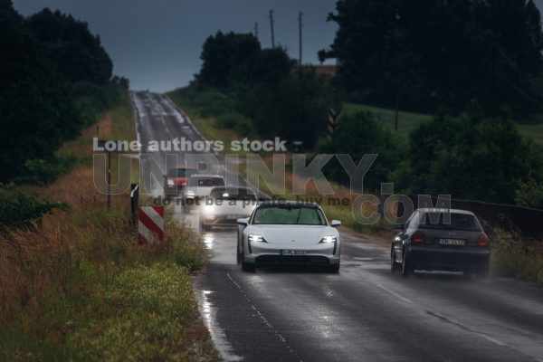 Porsche Taycan Turbo S drive fast during the rain